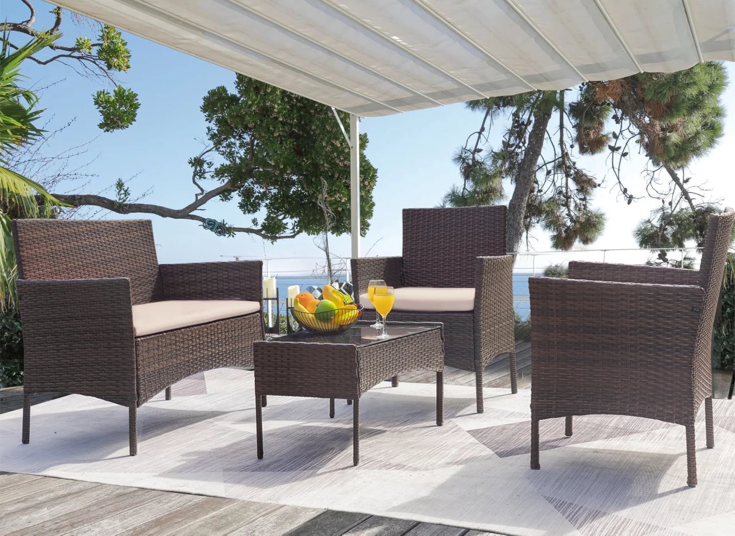 Luxurious 4 - Piece Rattan Patio Set with Cushioned Comfort and Elegant Glass Table - Nourishment Tapestry